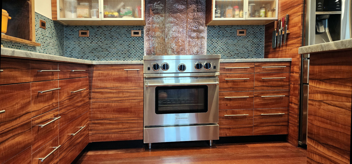 Symmetrical view of lower cabinets and stainless range